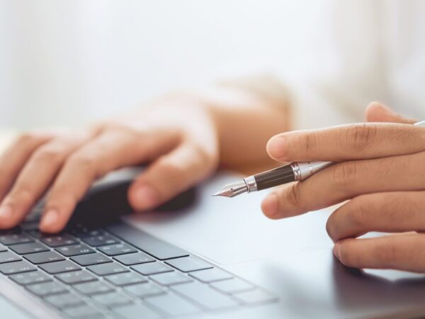 businessman-hands-using-laptop-computer-with-holdi-2026-01-07-01-37-17-utc
