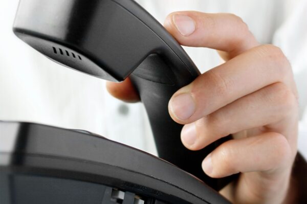 in-the-office-of-a-man-holding-up-the-phone-2026-01-07-00-42-34-utc